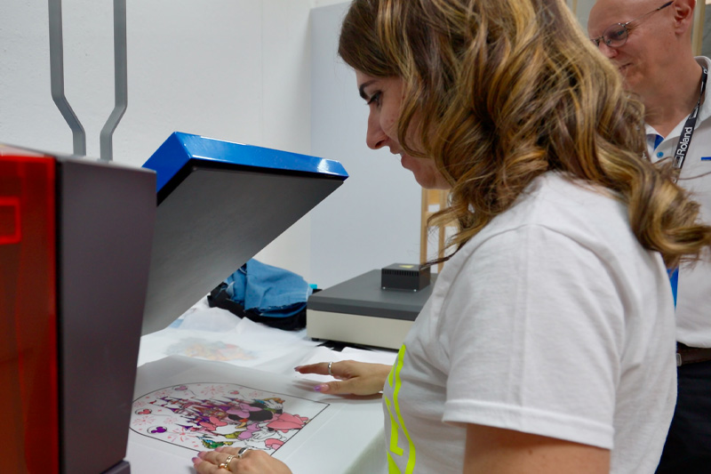 A person printing a t-shirt